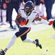 Bears receiver Darnell Mooney stiff arms a Jags’ defender, to the delight of Jags fans.